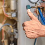 hvac employee with a thumbs-up