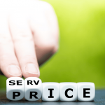 A hand holding dice that read "service price"